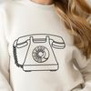 A simple, scalable vector graphic illustration of a telephone.