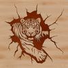 Vibrant Tiger Graphic A large feline animal with orange and black stripes is shown smashing through a wall in this vector design.