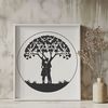 Embracing Tree Silhouette A stylized illustration of a tree with two embracing branches forming a heart shape.
