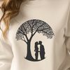 Love Blossoms in this Romantic Scene A pair of figures embracing beneath the branches of a tree, ideal for Valentine's Day or wedding decorations.