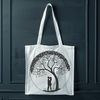 A stylized illustration of an embracing couple under a blooming tree, symbolizing love and unity.
