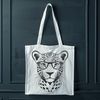 Stylized Jaguar Portrait with Glasses A stylized illustration of a jaguar wearing glasses, created as a vector design.