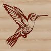 A colorful hummingbird in flight, with outstretched wings and beak.