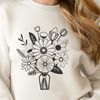 Free Flower Clip Art Download A bouquet of flowers in various colors arranged together in a decorative shape.