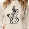 Horseback Rider Vector Art A cowboy silhouette on horseback with a wide-brimmed hat.