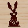 Cute Sitting Bunny Clip Art SVG File A cartoon rabbit sitting on its haunches with front paws tucked under its body.