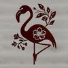 A colorful ornate flamingo standing on one leg in a floral setting.