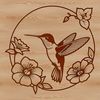Detailed Hummingbird Vector Design A vector design featuring a detailed hummingbird perched on a branch with intricate flowers.