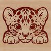 A close-up of an ocelot's face with its head slightly peeking out from behind a branch.
