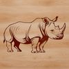 A rhino in its natural habitat, a large wild animal with distinctive horns.