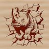 A large African rhinoceros standing in front of a cracked wall.