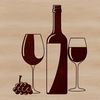 A bottle of wine in a glass on a table.