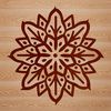 An abstract vector design featuring a detailed snowflake shape for various craft and design applications.