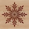 A delicate ornate snowflake design made up of intricate patterns and lines.