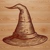 A witch's hat sits atop a broomstick on a dark background, surrounded by scattered candy and decorations.