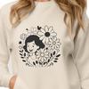 Free Vector Art of a Woman with Flowers A simple line drawing of a woman surrounded by floral elements.