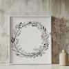 Floral wreath design made from individual flowers and leaves in vector format.