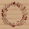 Beautiful Circular Arrangement of Flowers and Leaves A floral wreath design made up of various flowers and leaves in a circular pattern.